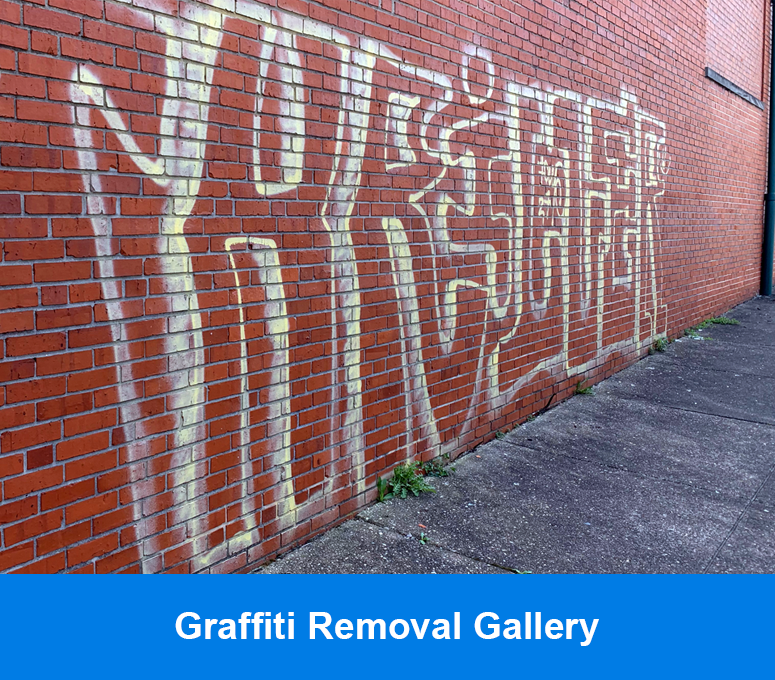 Graffiti removal on brick walls of businesses and homes