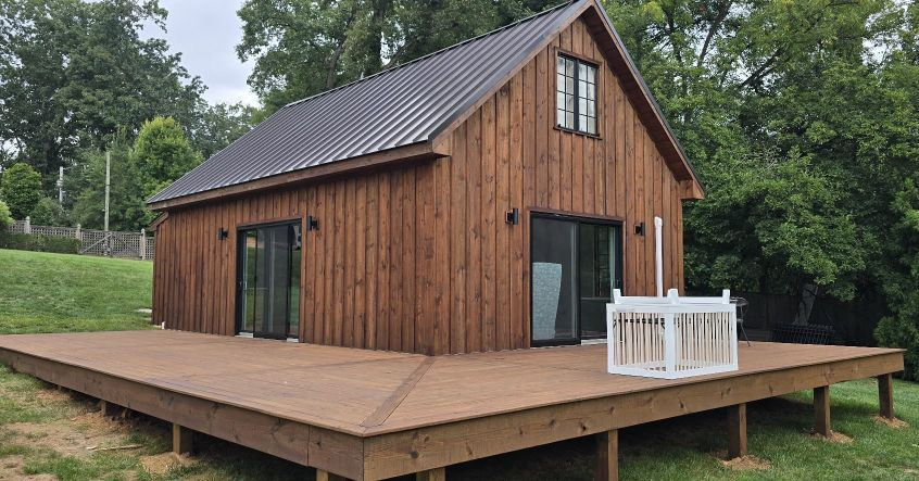 Old wooden deck power washed and stained to look like new wood porch