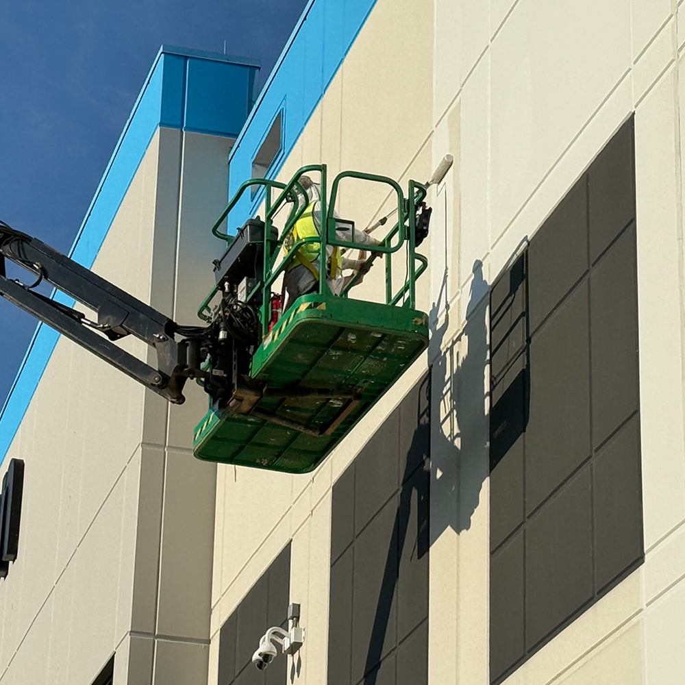 Commercial Painter painting the Amazon office building in DC